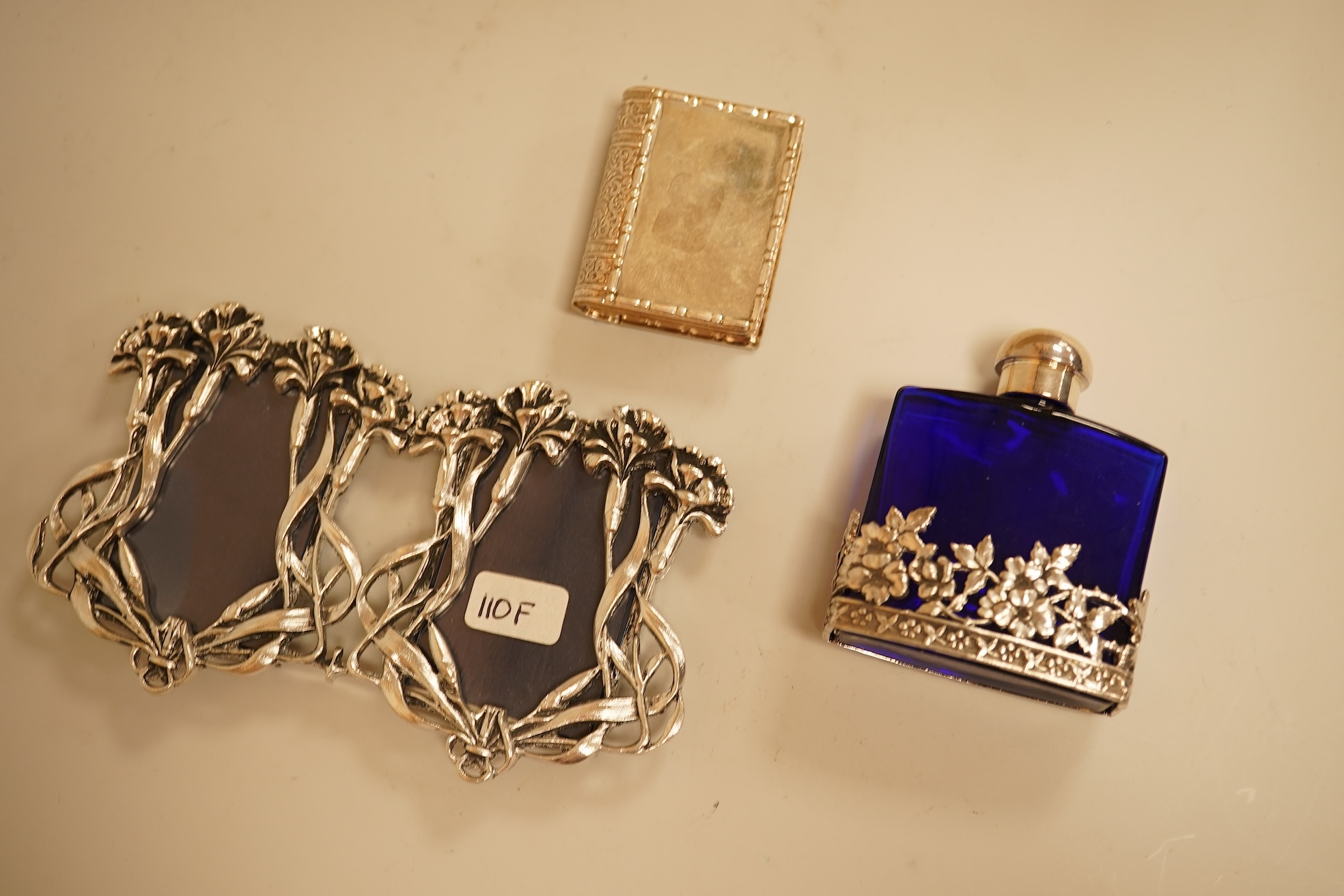 A collection of decorative glass and metal perfume bottles, miniature frames and pill boxes, green glass perfume bottle 15.5cm high.